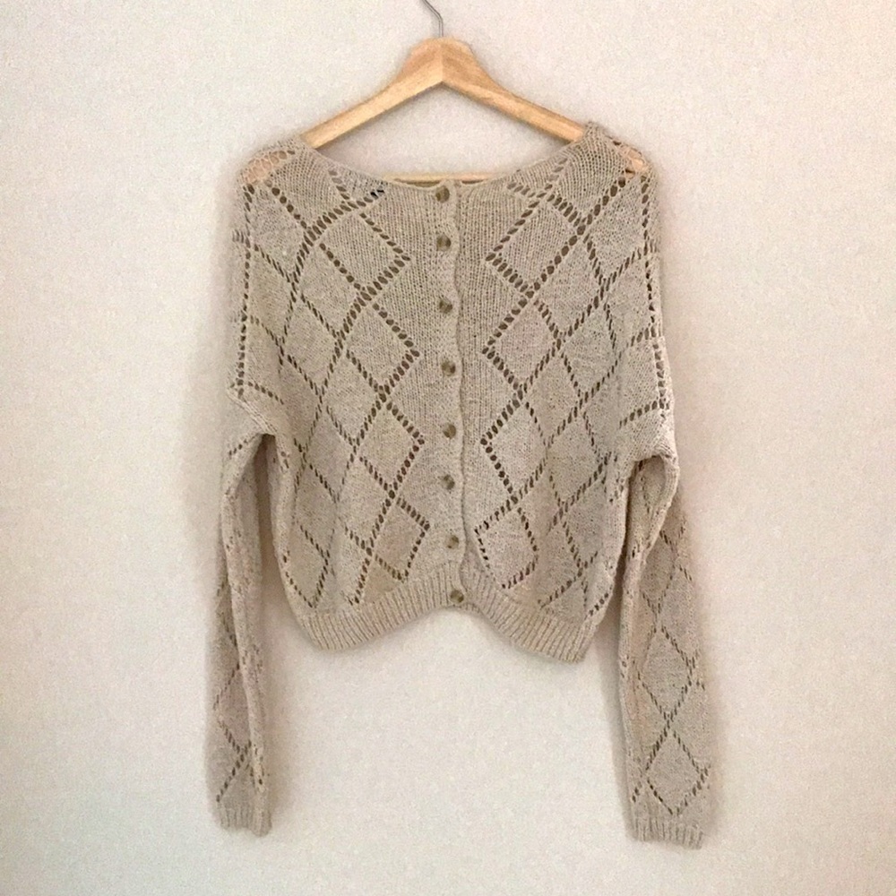 Off-white knitted / crocheted long sleeve button-up back sweater